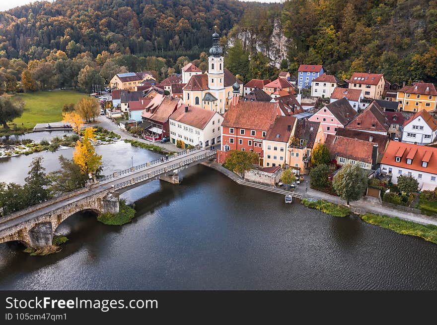 Image of an aerial view with a drone of the city view of the market Kallmünz Kallmuenz in Bavaria and the bridge over the rivers