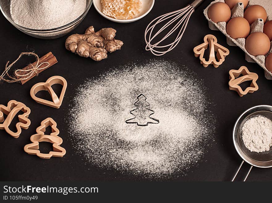 Shortcrust pastry for gingerbread.Christmas background for baking, top down view, copy space. Christmas and New Years, family celebration traditions. cinnamon, spices, flour on a white table. gingerbread