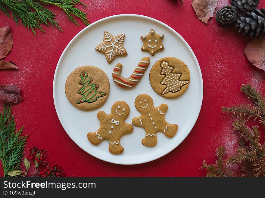 Gingerbread man christmas homemade cookies on red table