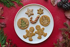 Gingerbread Man Christmas Homemade Cookies On Red Table Royalty Free Stock Photography