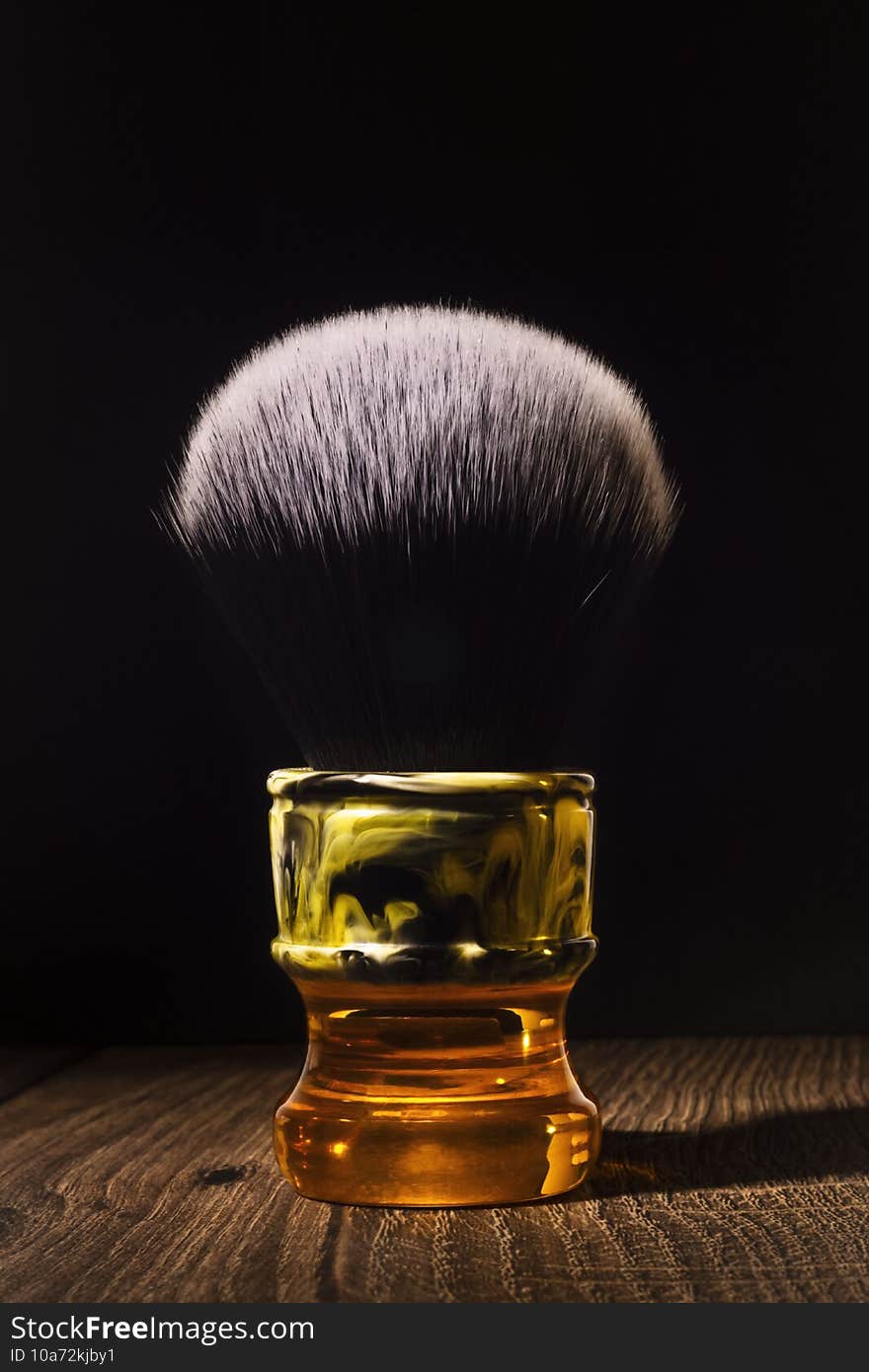 Posh shaving brush for classic shaving on a rustic background