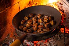 Chestnuts Roasted On The Smoldering Fire Stock Photos