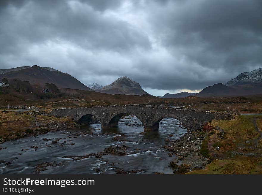 Powerful sky with the old stone bridge, characteristic and famous of the island. lots of water and dramatic sky. Powerful sky with the old stone bridge, characteristic and famous of the island. lots of water and dramatic sky