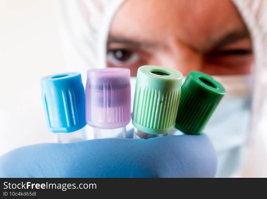 Selective focus shot of a doctor in mask and PPE protective suit for coronavirus