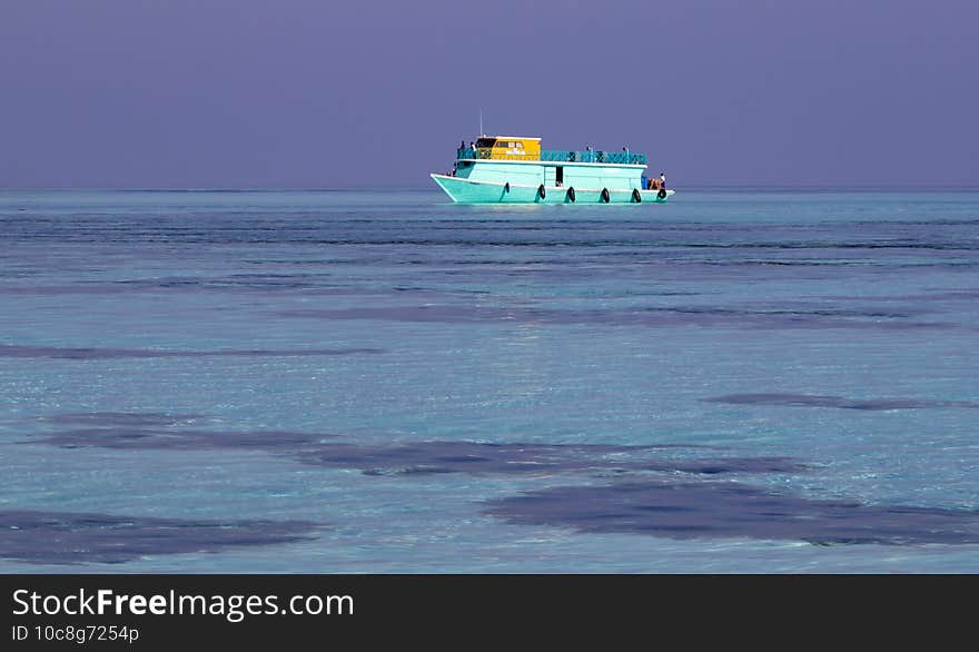 Ship in the pure blue sea