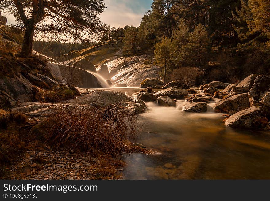 A beautiful shot of a scenic waterfall on the river, autumn nature scenery