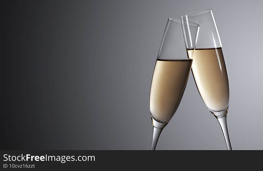 Glasses of champagne with splash, celebration theme concept. Glasses of champagne with splash, celebration theme concept