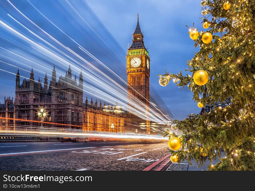 Famous Big Ben with Christmas tree on bridge in the evening, London, England, United Kingdom