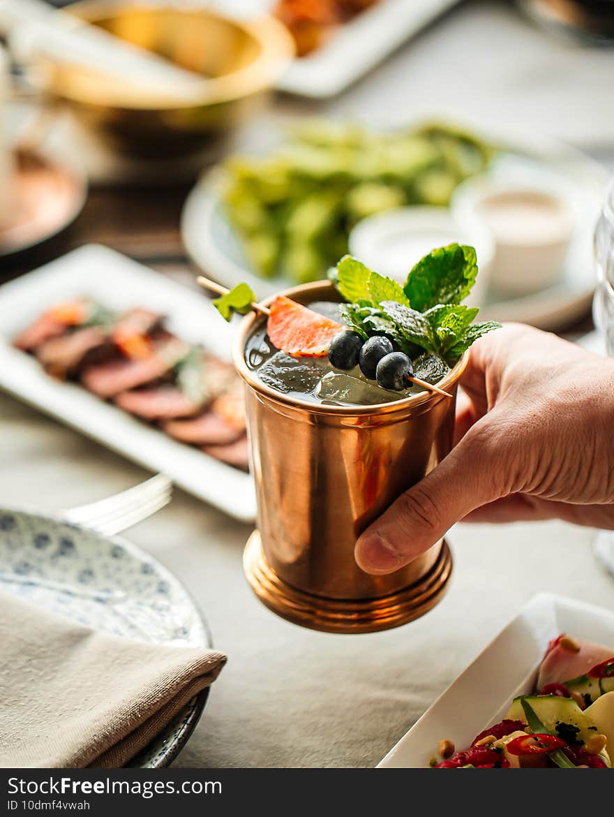 Refreshing champagne cocktail in a copper mug