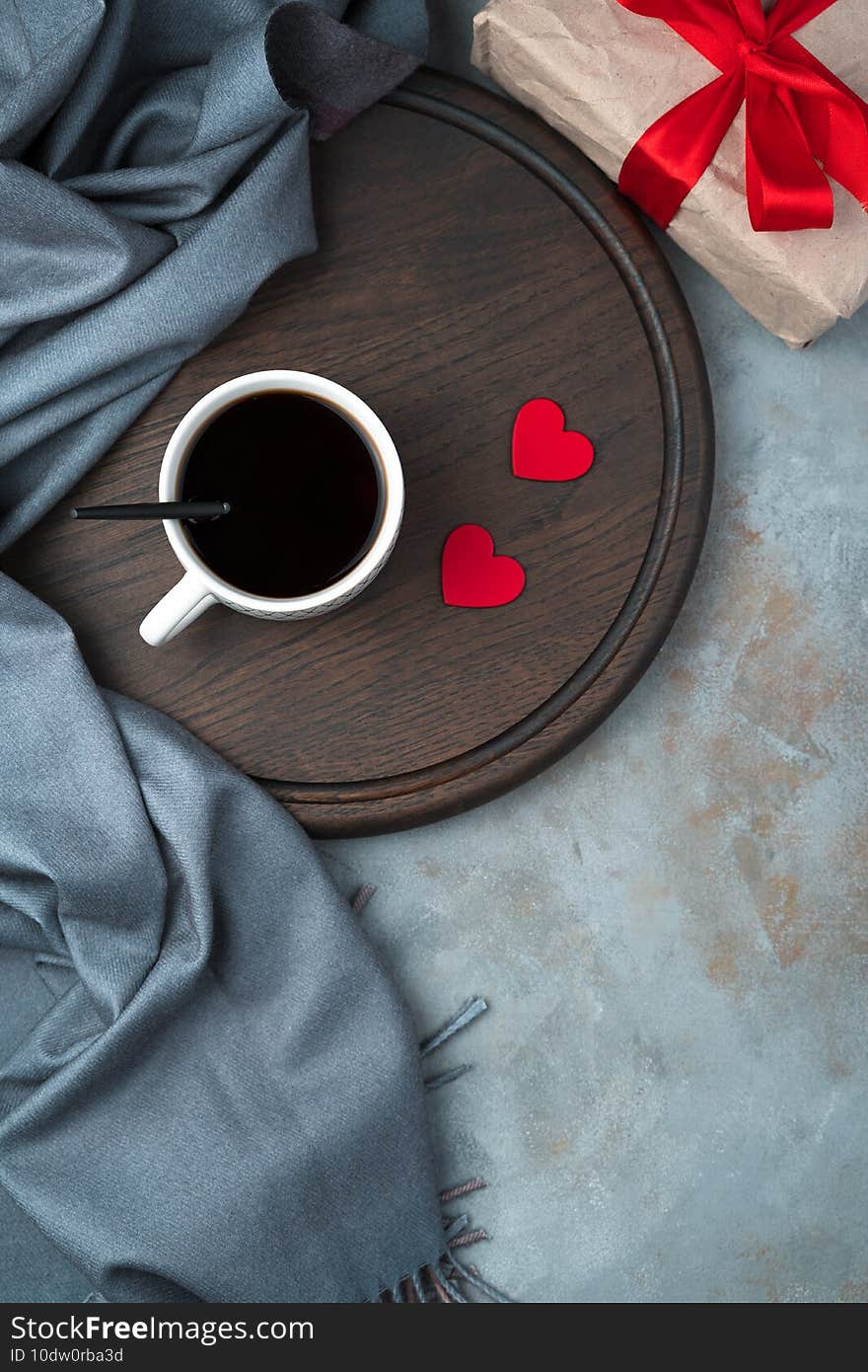 Coffee with hearts on a gray background. Top view, with space to copy.