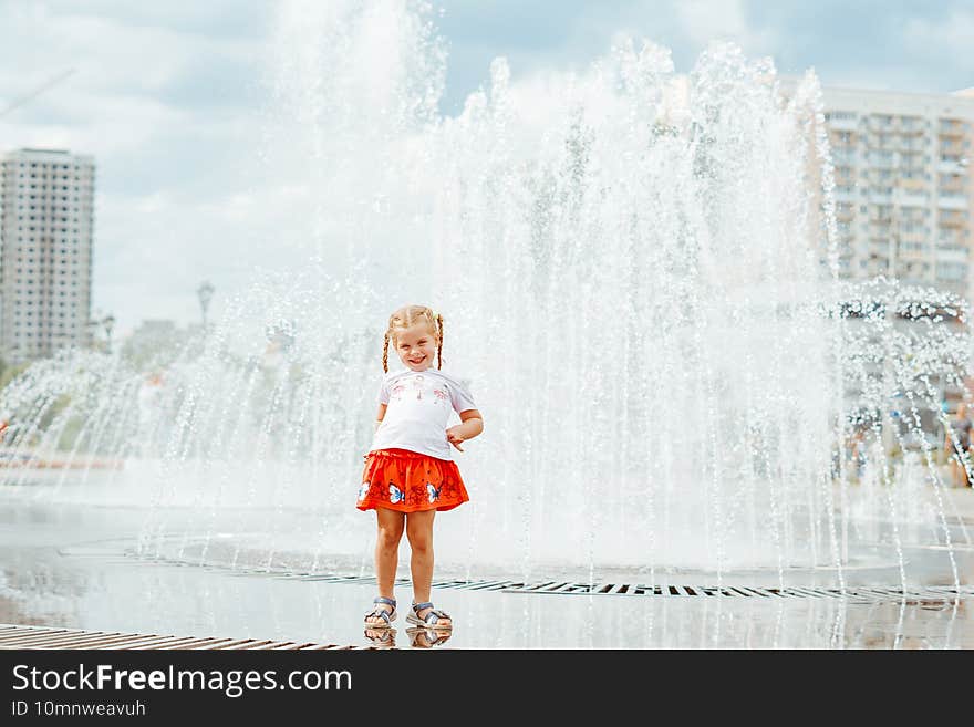 little girl near the fountain