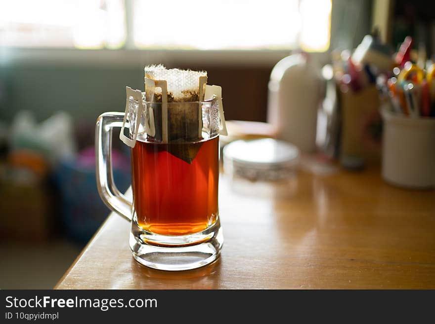 Making pour over coffee in a beer mug at home.