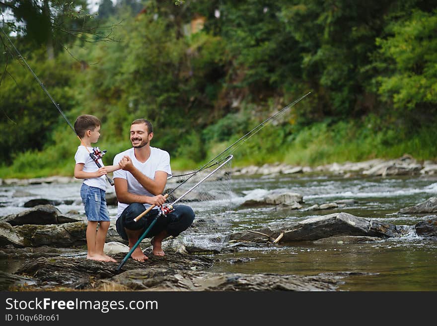 Father and son together fishing