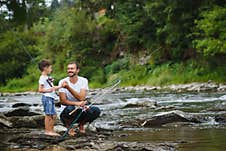 Father And Son Together Fishing Royalty Free Stock Photos