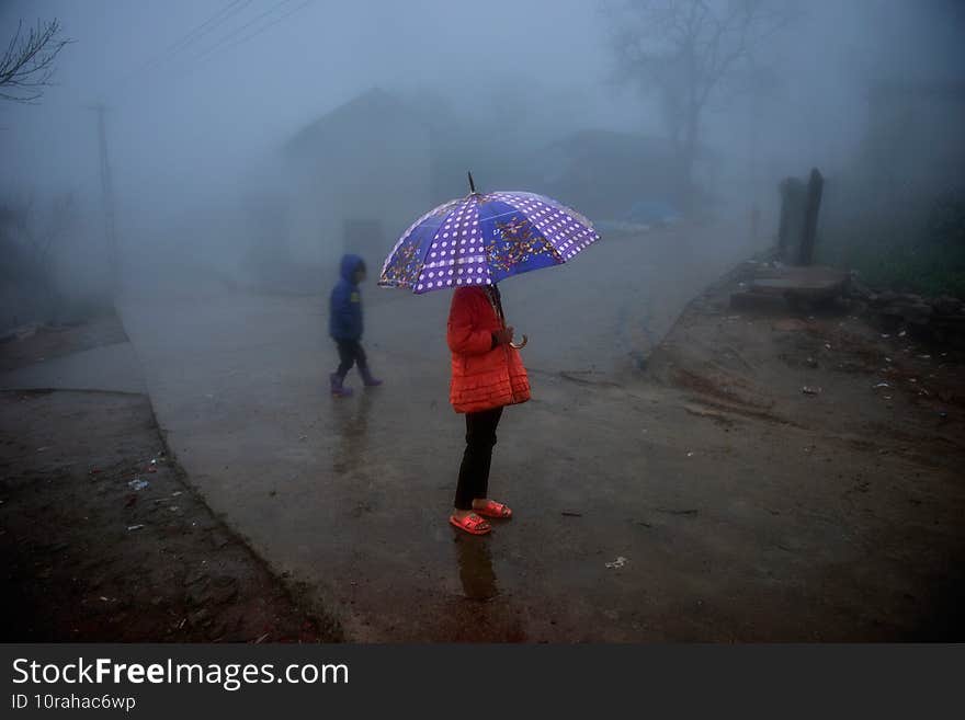 Hidden girl with umbrella