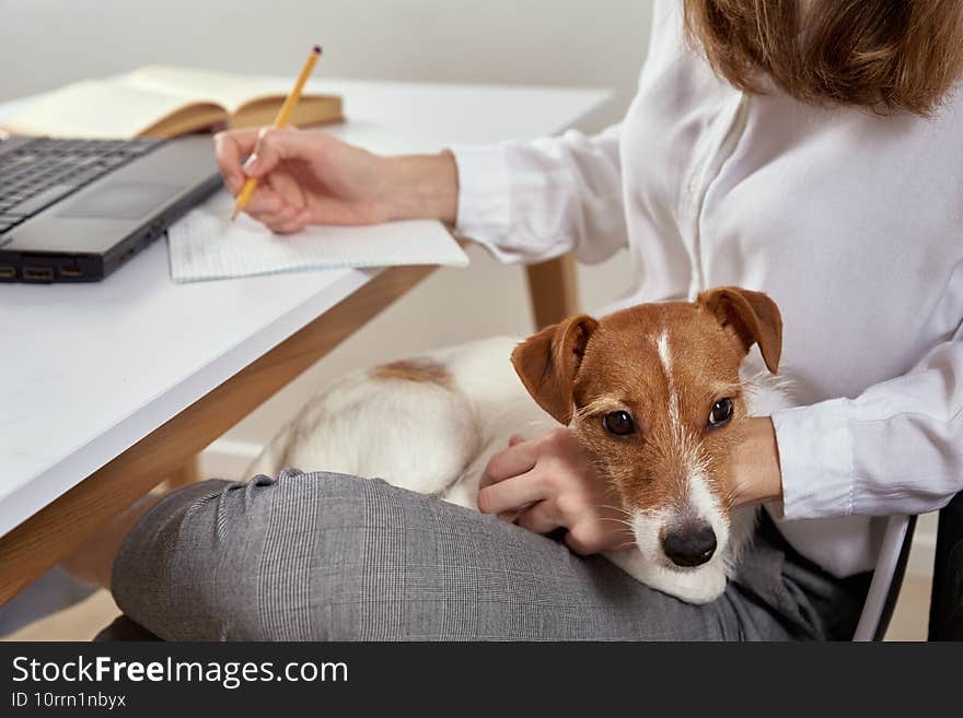 Woman working at home and using laptop. Online education and e-learning concept