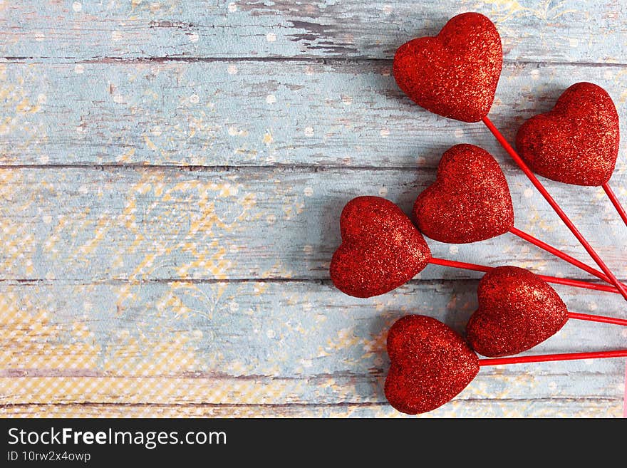 Red hearts for Valentine`s Day on the grunge background.