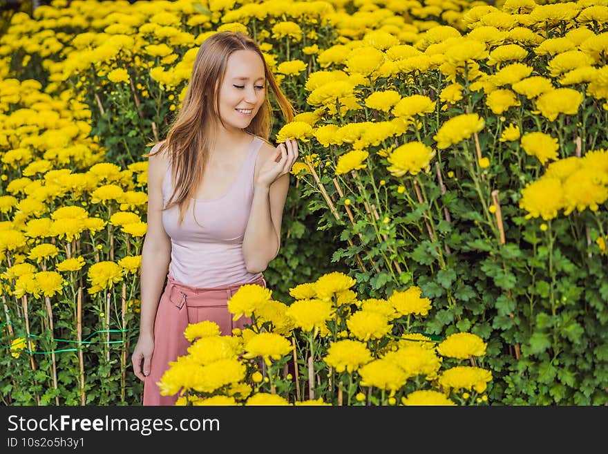 Beautiful Caucasian tourist woman in Tet holidays. Vietnam Chinese Lunar New Year in springtime