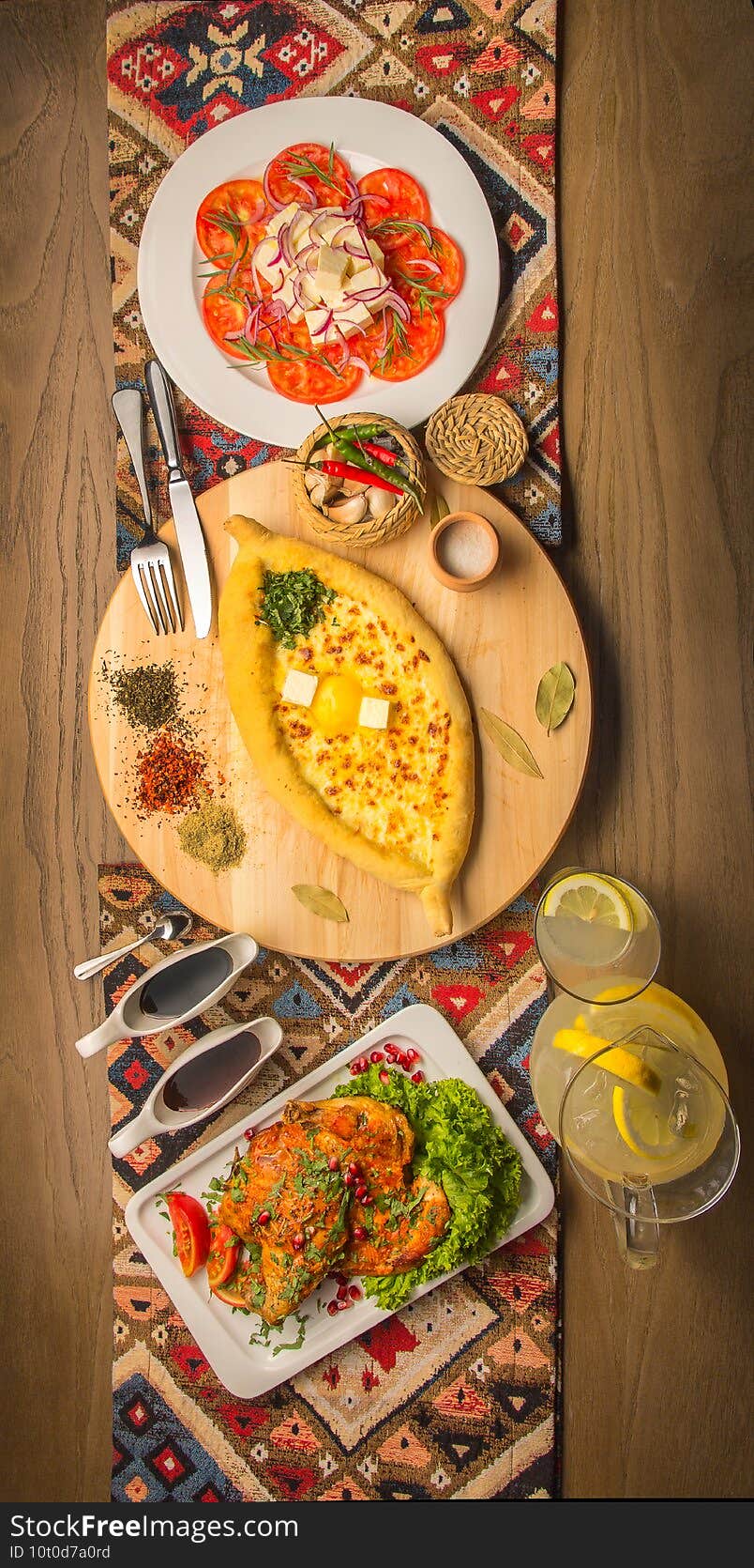 Georgian flat bread and the garlic chicken and tomato salad  goat cheese and spices. Traditional Georgian table for guests