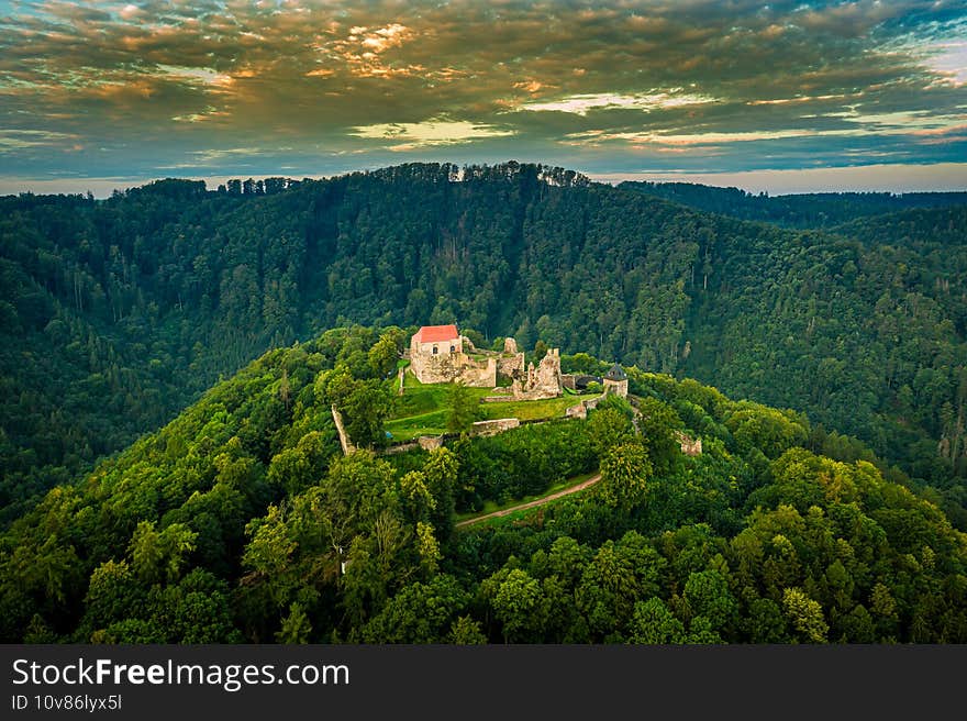 The extensive ruins of Potstejn Castle lie on a wooded conical hill southeast of the village of Potstejn in Eastern Bohemia and dominate the central part of Podorlicko. The extensive ruins of Potstejn Castle lie on a wooded conical hill southeast of the village of Potstejn in Eastern Bohemia and dominate the central part of Podorlicko.