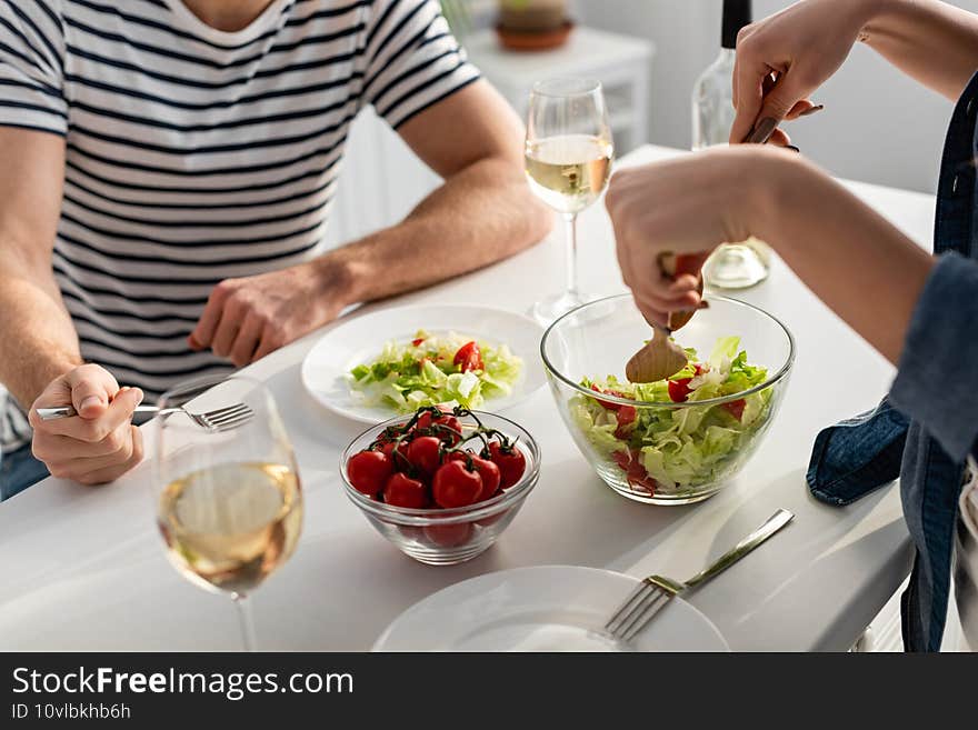 cropped view of couple preparing salad