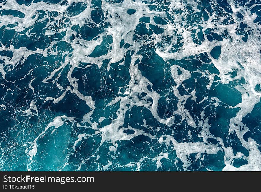 Ocean with blue water on a sunny day. clear sea water surface. blue sea water texture. natural pattern. used as background.