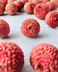 One Lychee Among Other Lychees. Stock Photos