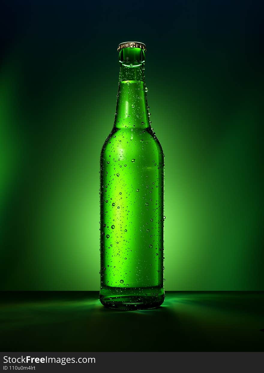 Single green beer bottle with water drops against green illuminated background