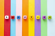 Adoption Word Colorful Striped Background Rainbow. Royalty Free Stock Images