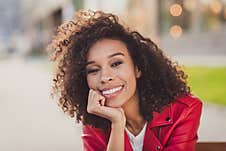 Photo Of Charming Sweet Wavy Lady Wear Red Jacket Smiling Hand Arm Chin Outside Urban City Street Royalty Free Stock Photos