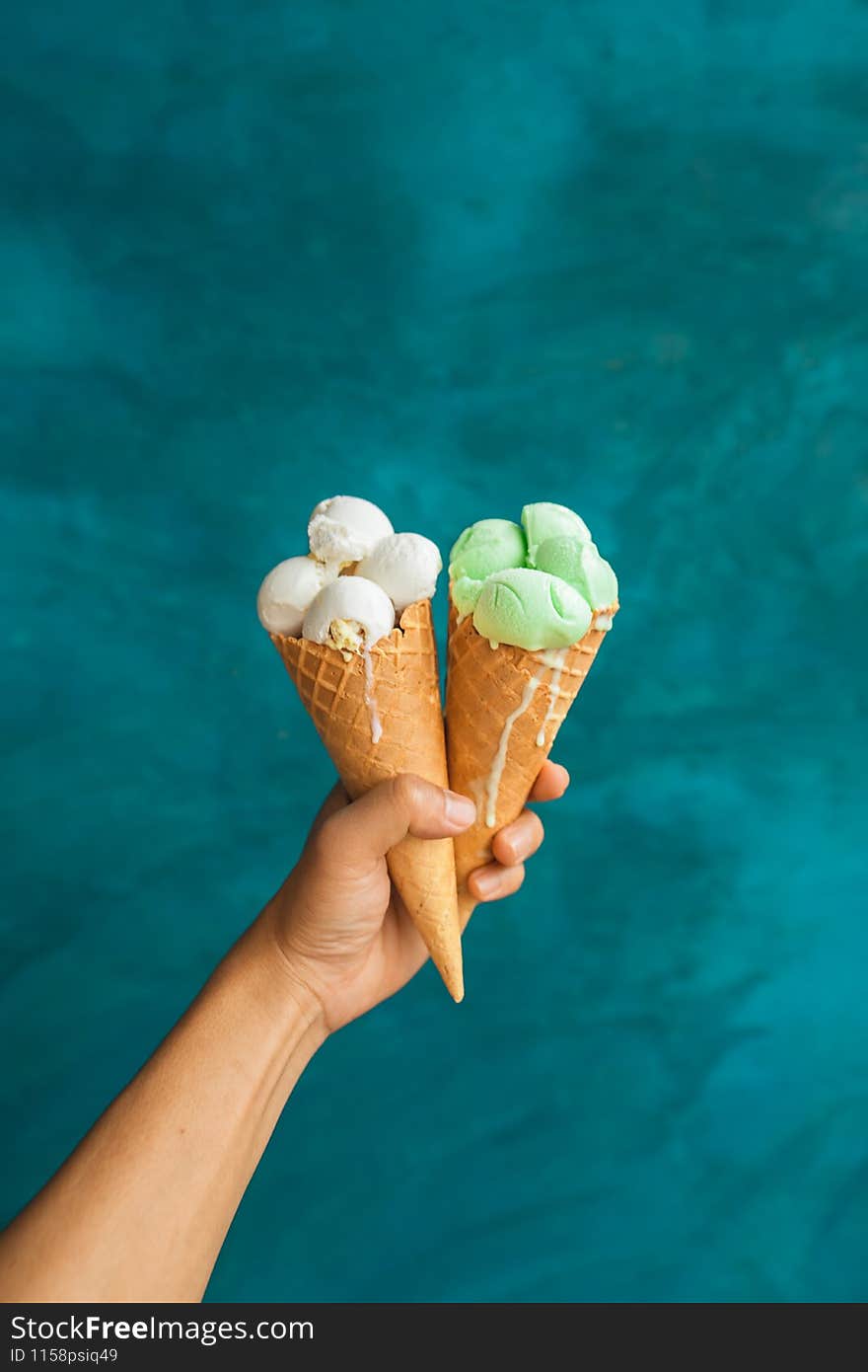 Ice cream cone,Ice cream in hand during the hot day