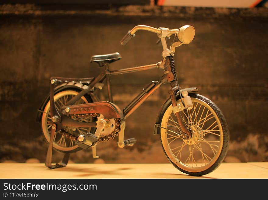 Retro styled image of a nineteenth century bicycle  on black background. Retro styled image of a nineteenth century bicycle  on black background