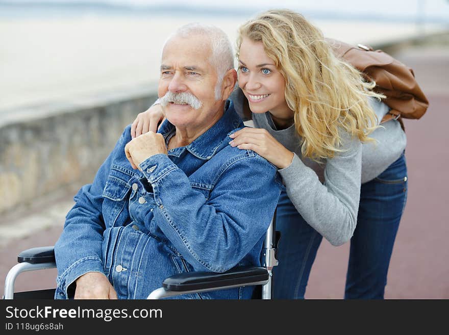 senior father with adult daughter at sea caucasian