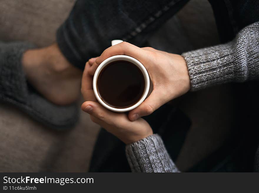 A man with a cup of coffee