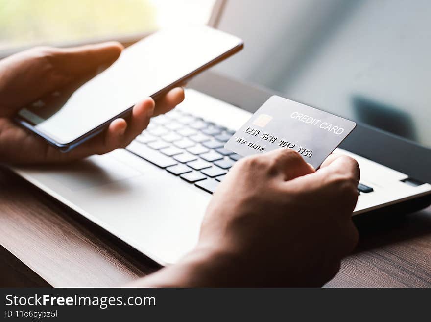 Using smartphone for online shopping. Credit card internet pay