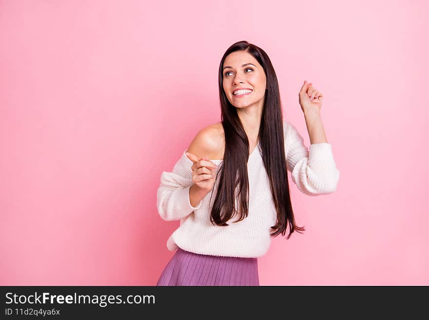 Photo of young attractive smiling cheerful positive excited girl dancing look copyspace  on pink color background.