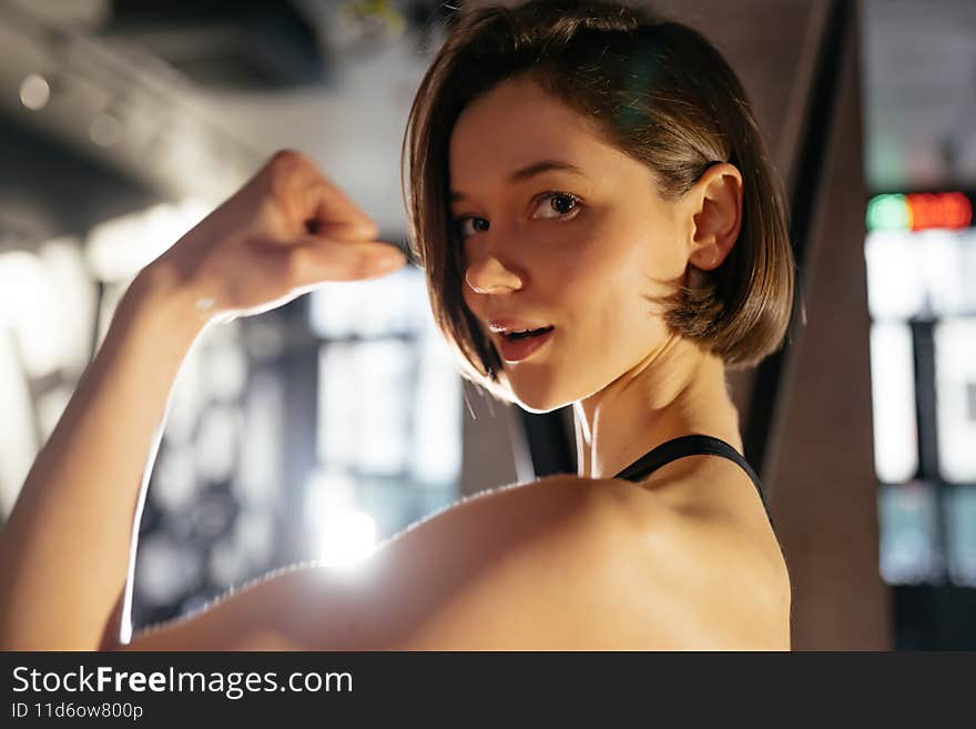 Portrait of Confident Healthy Brunette Woman Wearing Performance Wear Standing Gym. Portrait of Confident Healthy Brunette Woman Wearing Performance Wear Standing Gym
