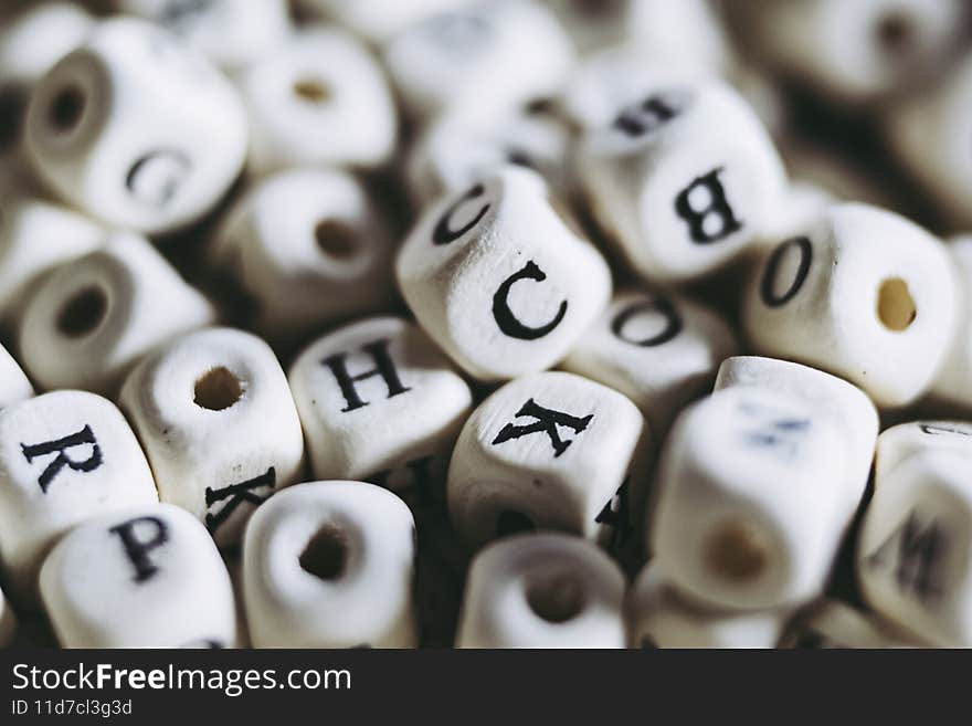 Wooden cubes with black and white letters