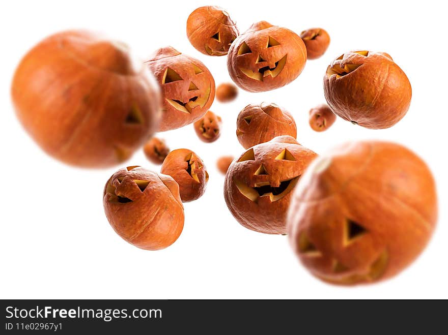 Glowing pumpkins levitate on a white background