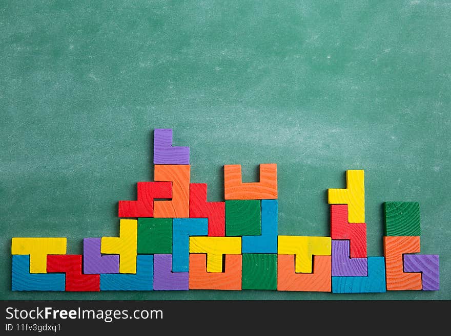 Creative solution for idea - business concept, jigsaw puzzle on the green blackboard