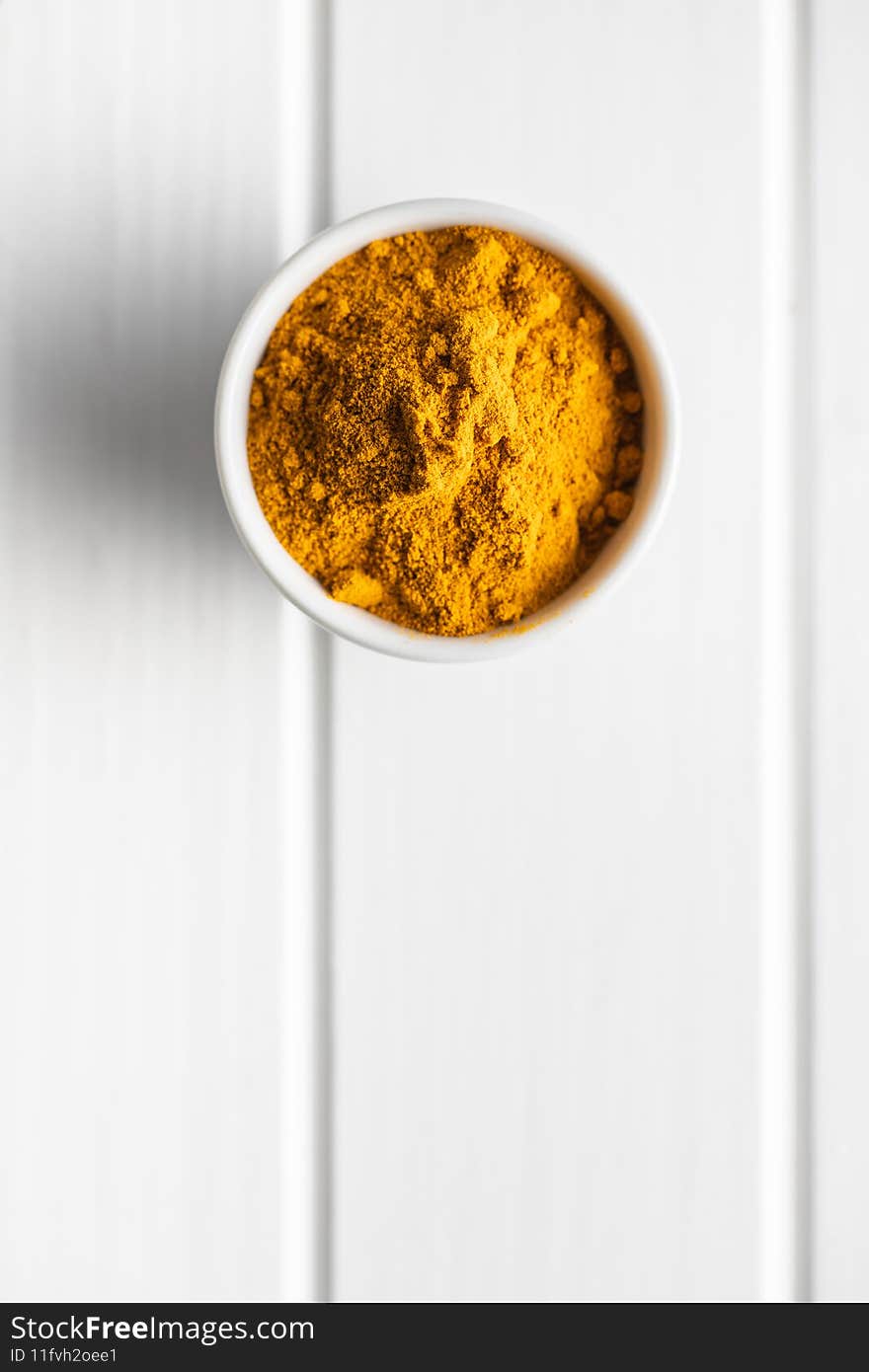 Indian turmeric powder. Turmeric spice. Ground turmeric in bowl