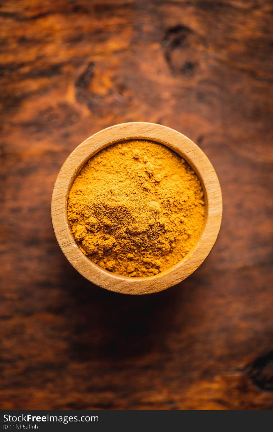 Indian turmeric powder. Turmeric spice. Ground turmeric in bowl