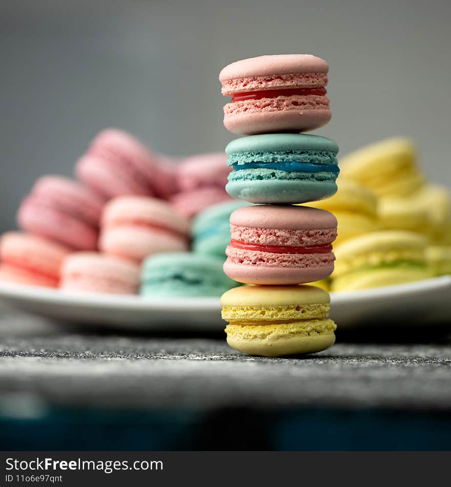 Multicolored Macaroon cookies or cakes tricky to tower. LGBT colors concept. Romantic Sweet gift or present for beloved person. Holiday or festive mood concept. Exquisite goodiesfor refined taste.