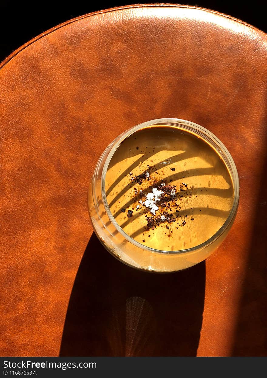 A cup of cocoa with chocolate on the table.