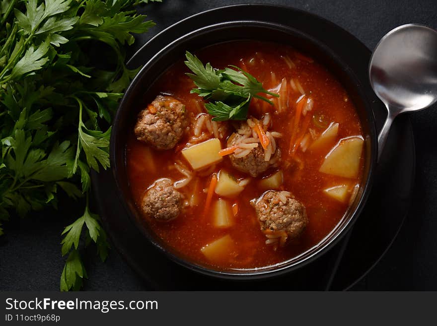 Patatesli Sulu Kofte - Turkish soup with meatballs in white bowl