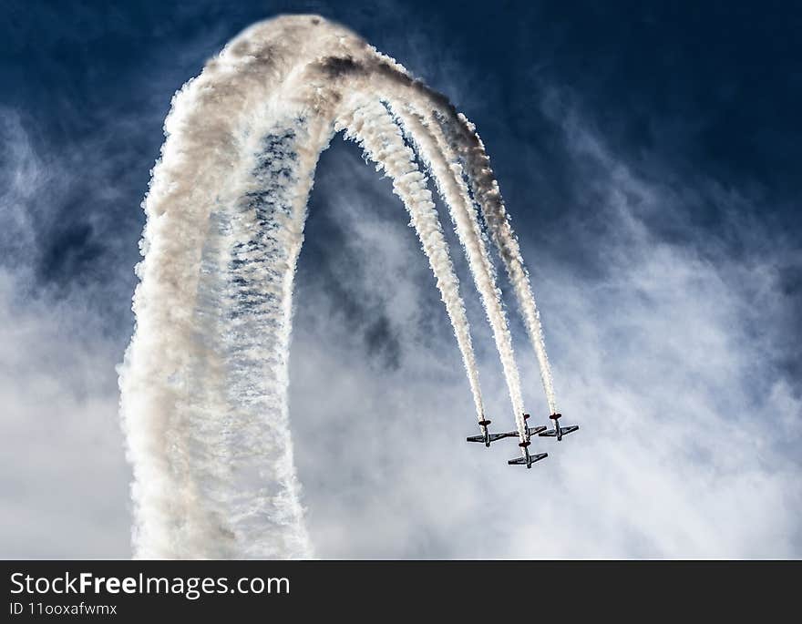This breathtaking aerobatic stunt was performed by the nationally renowned Aeroshell Aerobatic Team as part of The Great Georgia Airshow (GGAS). The AeroShell Aerobatic Team performs tight, awe-inspiring formation aerial maneuvers in front of millions of airshow fans all over North America. The team uses single-engined, North American AT-6 Texan aircraft for their stunts. The Texan was the primary training platform for all U.S. airmen in World War II. This breathtaking aerobatic stunt was performed by the nationally renowned Aeroshell Aerobatic Team as part of The Great Georgia Airshow (GGAS). The AeroShell Aerobatic Team performs tight, awe-inspiring formation aerial maneuvers in front of millions of airshow fans all over North America. The team uses single-engined, North American AT-6 Texan aircraft for their stunts. The Texan was the primary training platform for all U.S. airmen in World War II.