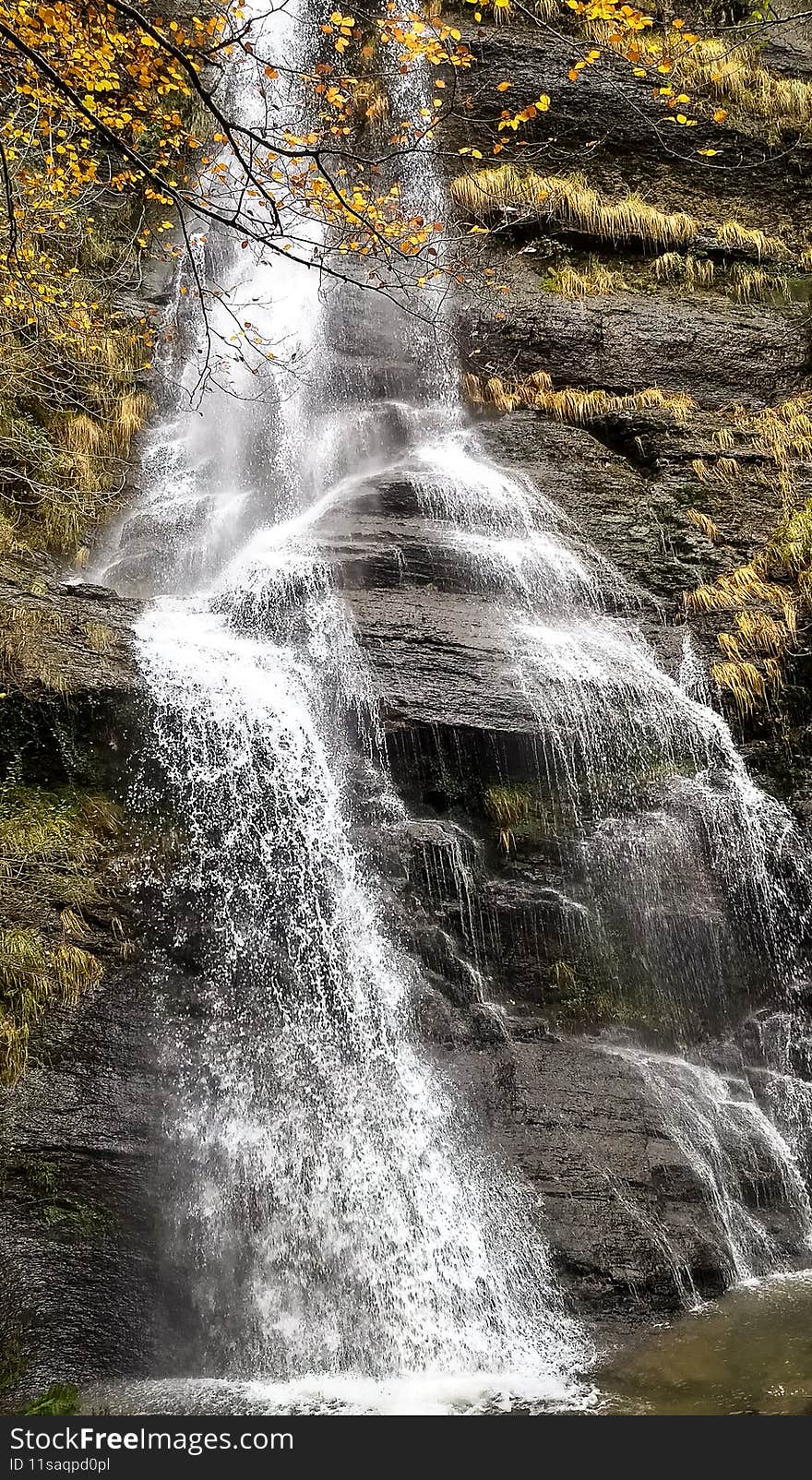 Big waterfall in Basque national park in autumn colors, Basque Country, Spain