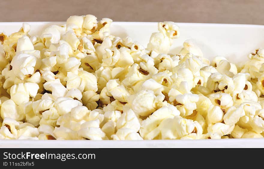 Freshly popped pop corn in a bowl ready to eat.