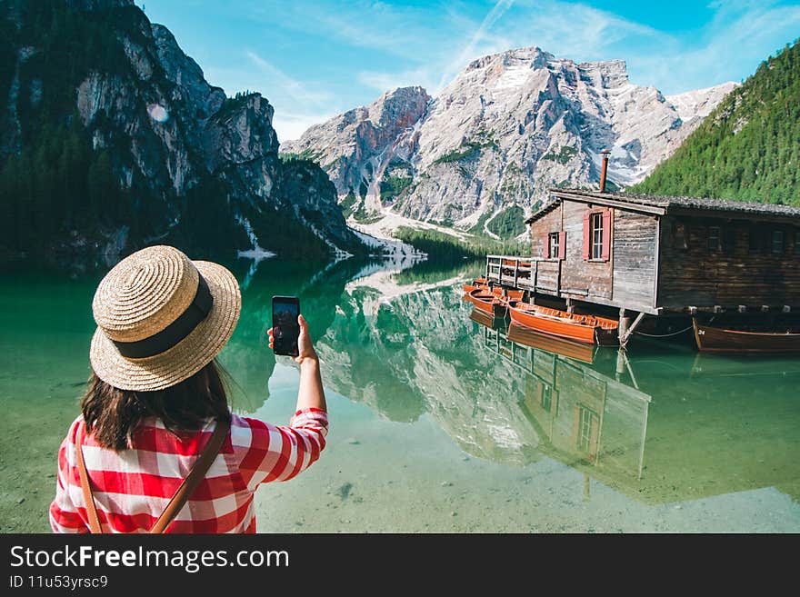 Tourist Woman Taking Picture On The Phone Of Mountain Lake
