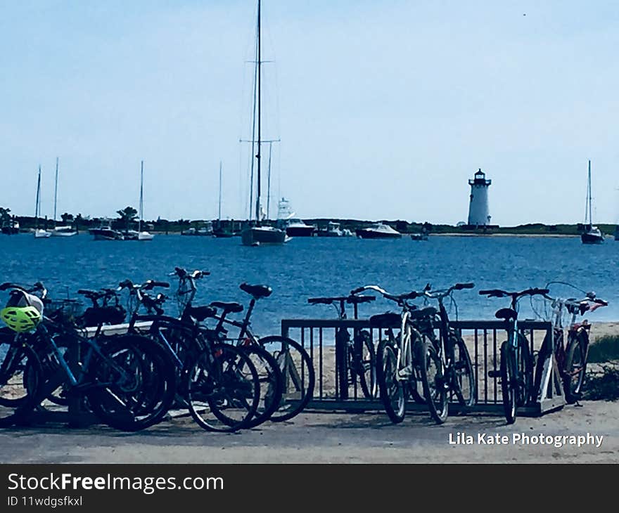 Bicycles, best source of travel on Martha`s Vineyard, bicycle.. rent or own, view of lighthouse from the ferry parking lot. beautiful blue water, ocean, sand, beach, good food, good fun, laughs, relax, unwind, meditate, just not on bike. Bicycles, best source of travel on Martha`s Vineyard, bicycle.. rent or own, view of lighthouse from the ferry parking lot. beautiful blue water, ocean, sand, beach, good food, good fun, laughs, relax, unwind, meditate, just not on bike